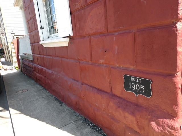 Plaque showing the date of construction is located on front of building facing Court Street (view from northwest to southeast)