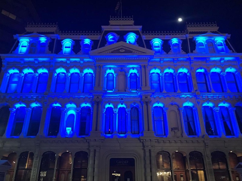 The Grand honors frontline workers in 2020 with blue lights during the COVID-19 Global Pandemic