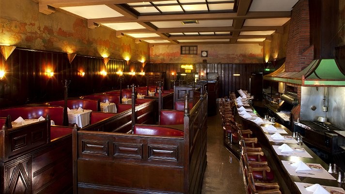 Musso and Frank dining room featuring the classic red leather booths