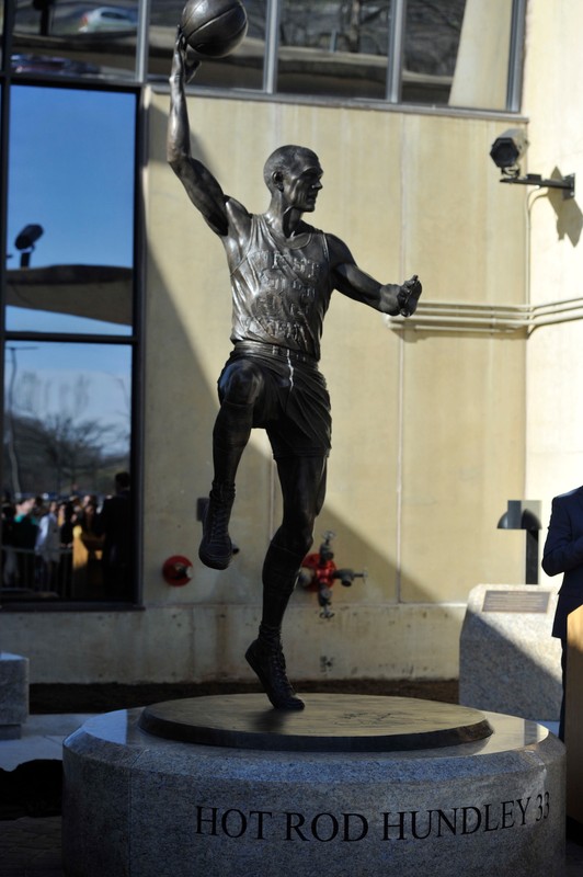 The Hot Rod Hundley statue at its unveiling ceremony, showing Hundley's infamous hook shot.