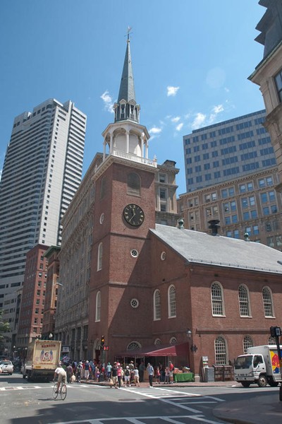 In this picture, you can see the old clock on the side of the building.