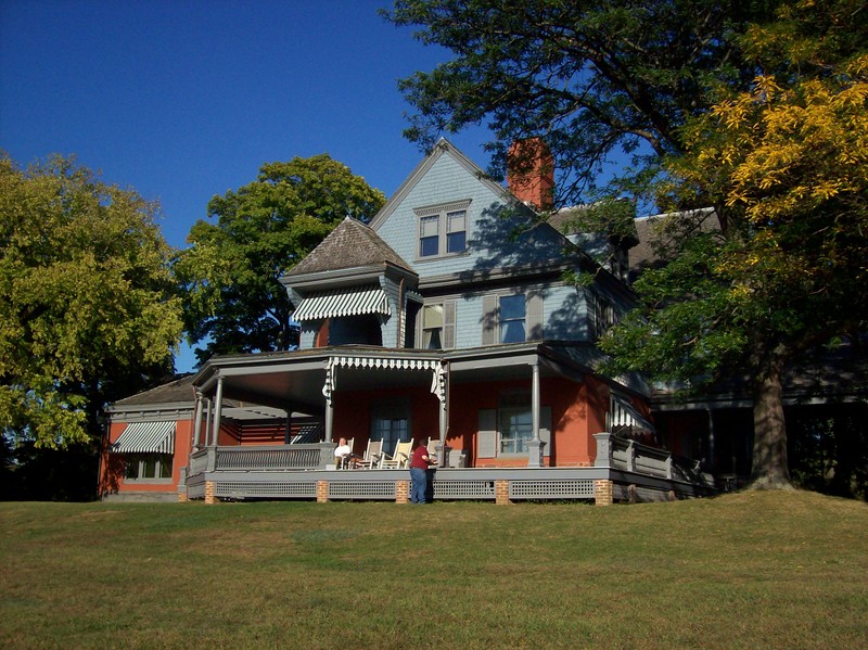 Theodore Roosevelt's Queen Anne style home Sagamore Hill. Guided tours are available for visitors to view many of Roosevelt's original furnishings, gifts from foreign dignitaries, and hunting prizes. 