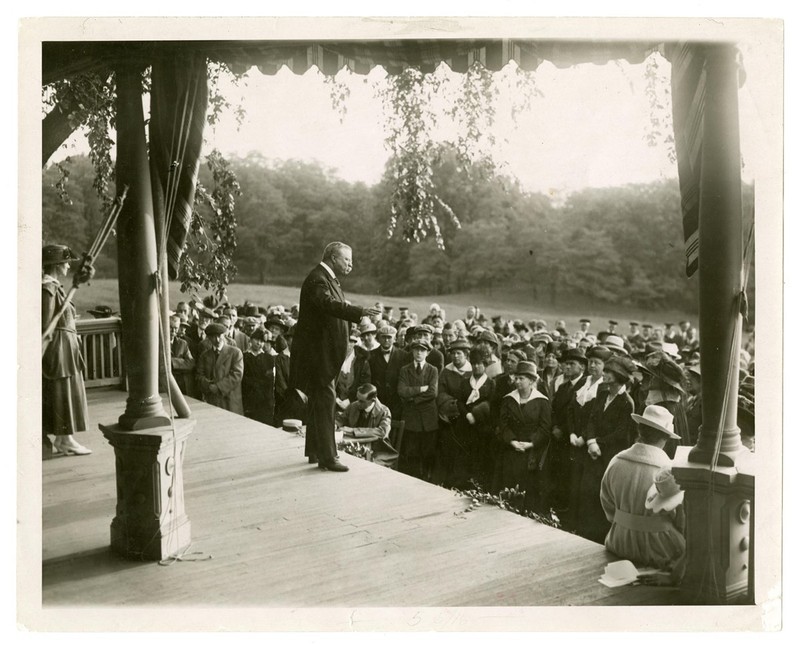 Theodore Roosevelt speaking to a crowd of women suffragist delegates on the porch of Sagamore Hill, 1917