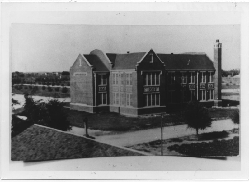 black and white photo of exterior of brick building