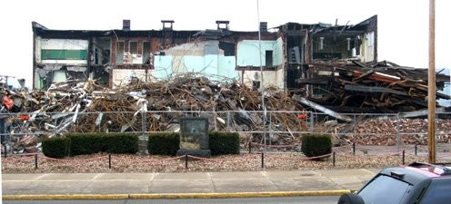 Demolition of Moundsville High School with marker in front.