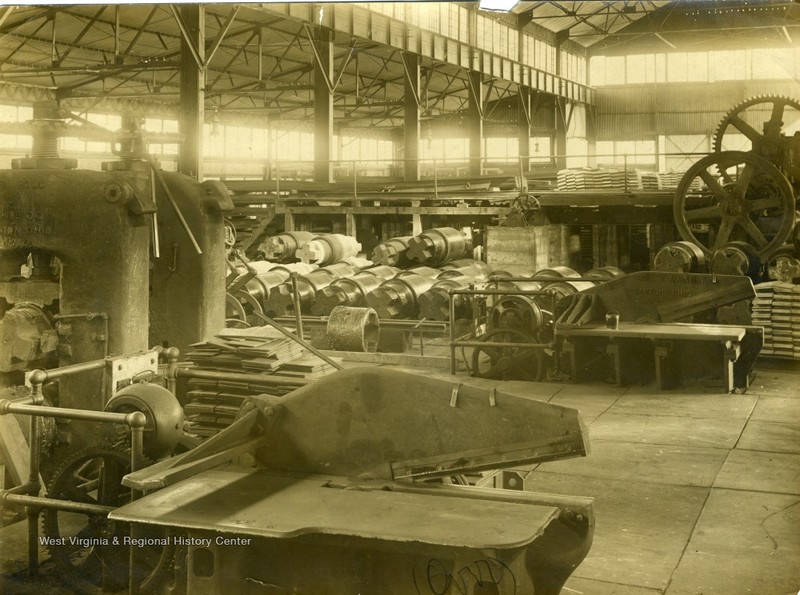 Interior of the mill, showing the rollers used to flatten out sheets of tin.