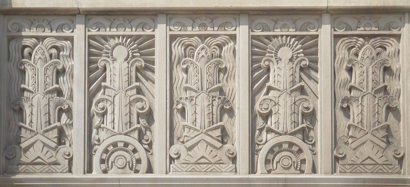 The building features elaborate ornamentation, including depictions of a sunbeam to reflect the KCP&L's role as a provider of light. Image obtained from Power & Light Apartments. 