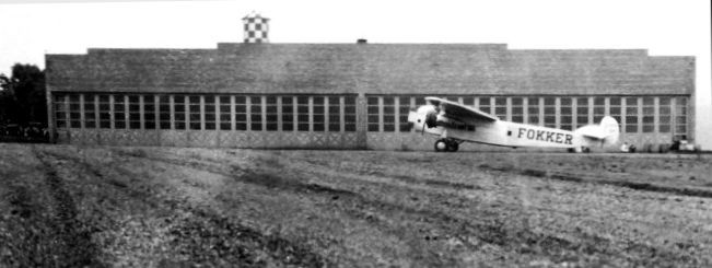 An April 1929 photo by J.E. Anderson of a Fokker Trimotor at Glen Dale Fokker Field, in front of the north end of the Fokker factory where it was built.