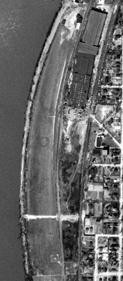 As seen in a circa 2001-2005 USGS aerial photo, a total of four hangars were located along the northeast side of the runway.