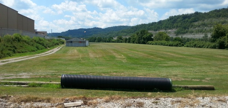 A 7/24/16 photo by Rick Harshbarger looking south along the Glendale runway, with the former Fokker airplane factory visible at left.