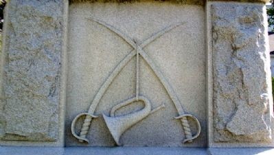 West face of the memorial representing the Caverly emblem.