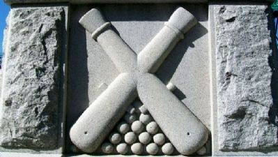 East face of the memorial representing the Artillery emblem.