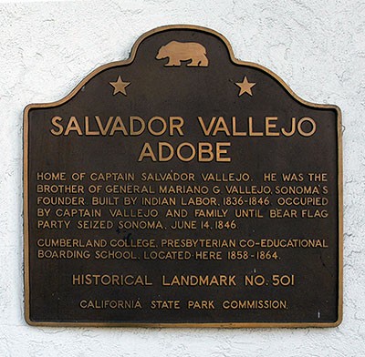 Plaque located outside adobe location. A brief history of the building.