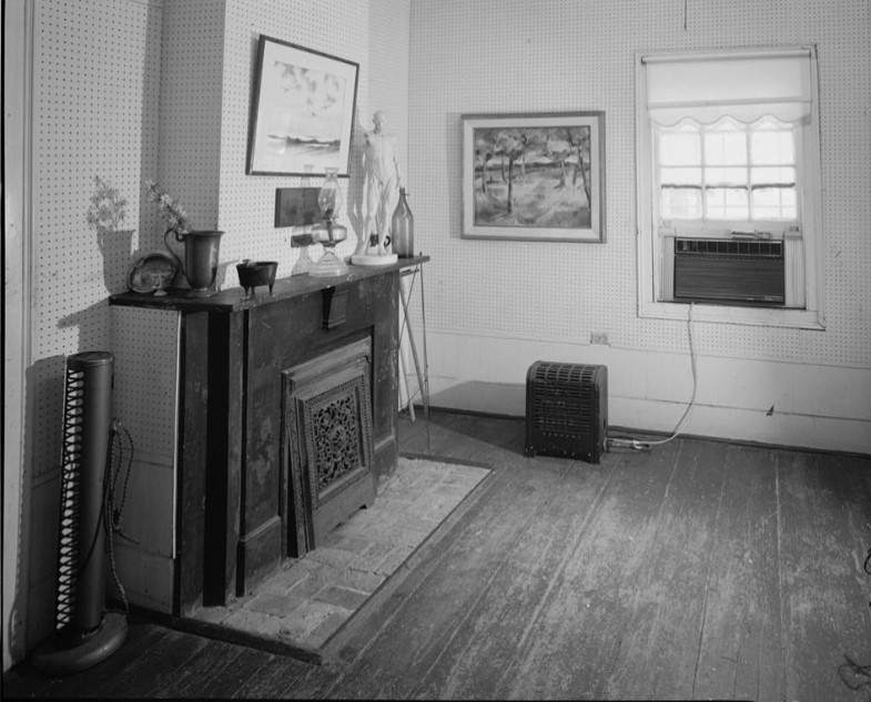 Fireplace with cast iron grill in left end room in 1979 Engdahl photo (HABS Survey TX-3282)