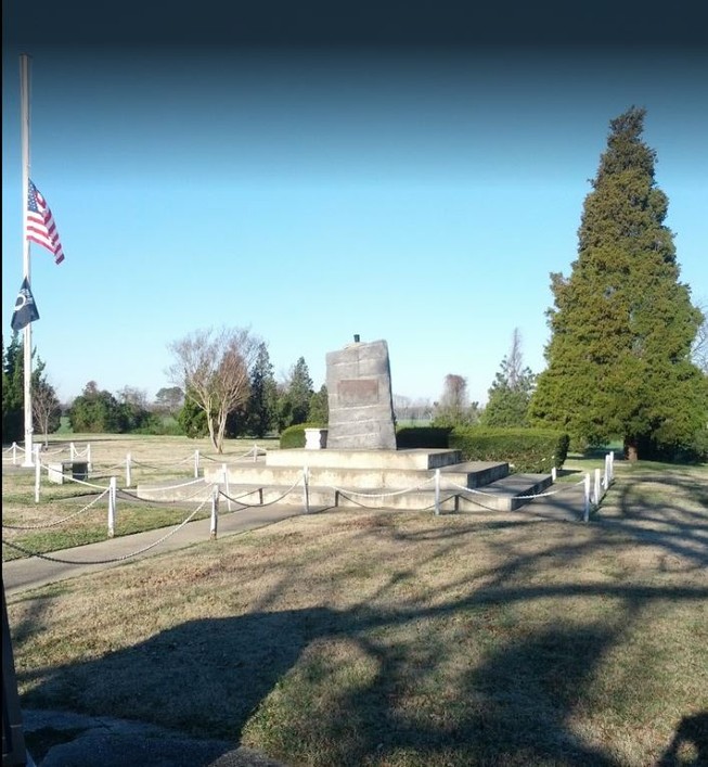 The monument is surrounded by concrete steps. 