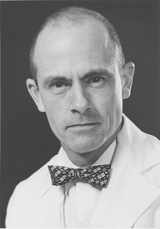 A black and white portrait of Charles Dotter features the physician wearing a white coat and a bow tie. 