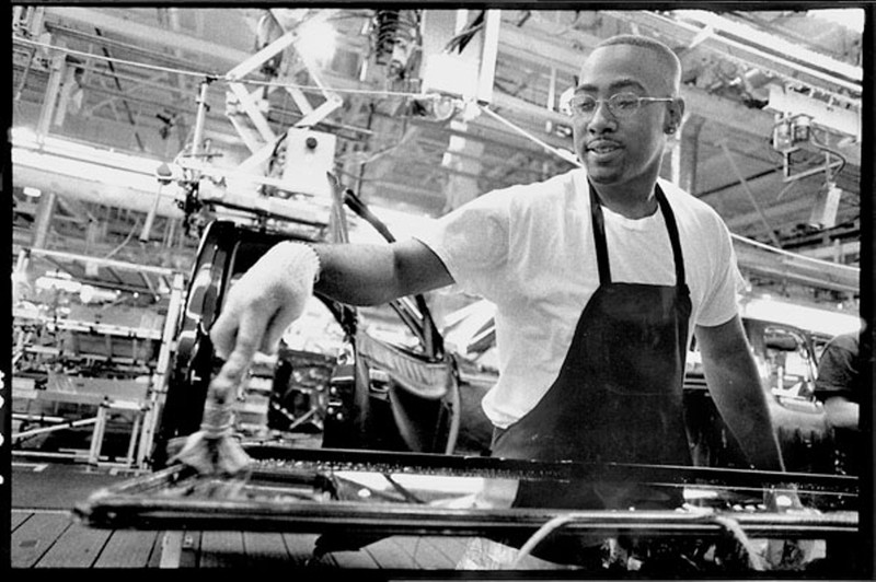 A worker at the joint Toyota-GM NUMMI plant, which served as a national model  for quality, employee satisfaction, and production output. East Bay Express.