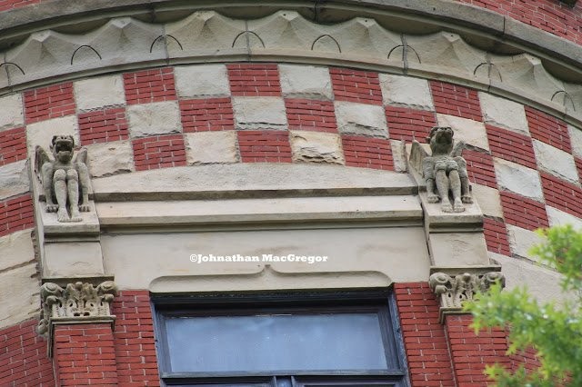 Two of the gargoyles that ring the standpipe near its top.