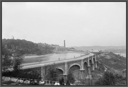 A 1901 photo of Eden Park's reservoir, which has since been removed. Station no. 7 and the Ohio River can be seen in the background.