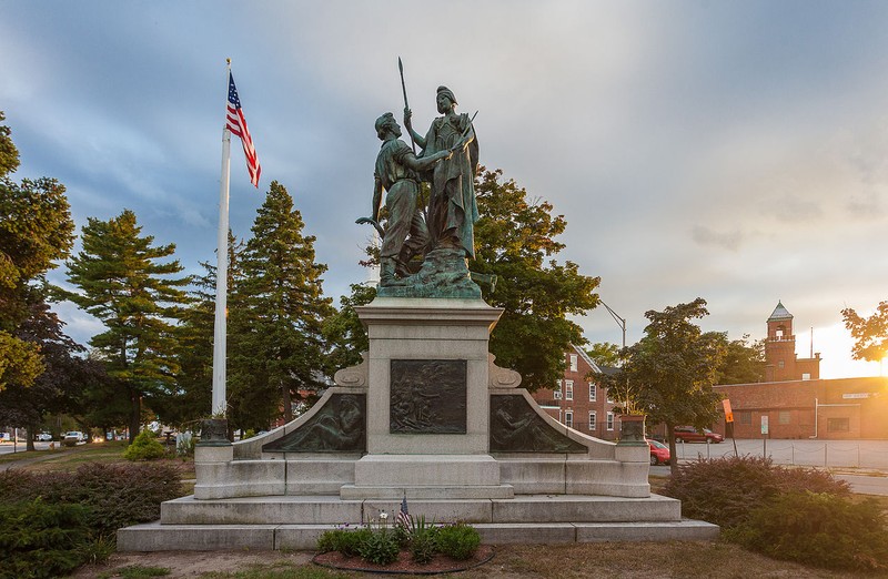 The sculpture stands on top of a granite base.