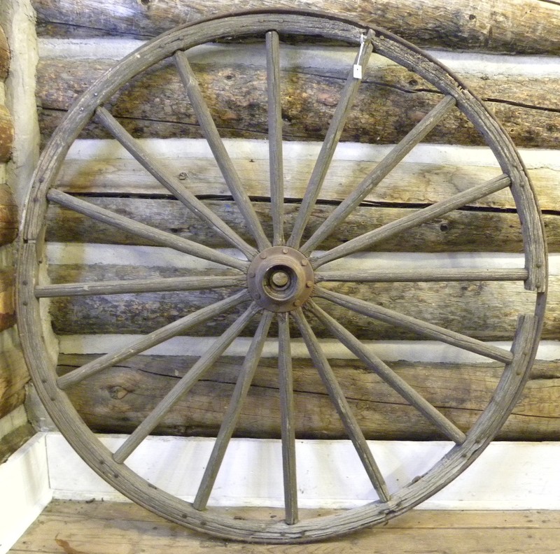 This wooden wagon wheel with iron trim and hardware was constructed using round head nails can be found on display in Bill’s Ranch House.