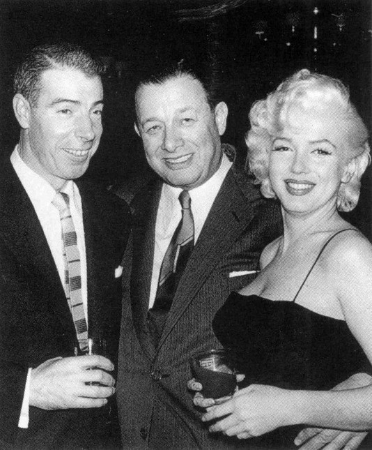 Joe DiMaggio, Toots Shor, and Marilyn Monroe attending Jackie Gleason's birthday party at Toots Shor's Restaurant, February 26, 1955