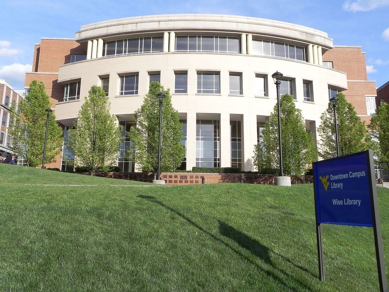 The modern library on the Downtown campus at WVU is built onto the front of the old Wise Library. Wikimedia Commons.