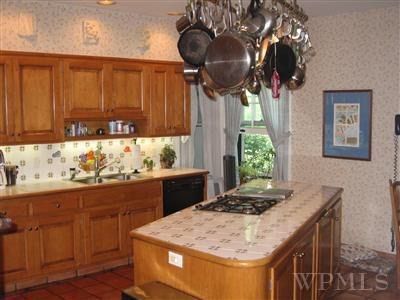 Cabinetry, Countertop, Furniture, Picture frame