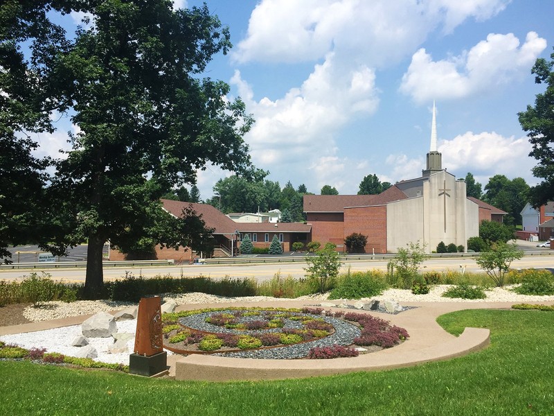 The sculpture garden's paths and flower beds swirl across the landscape to create a unique experience for visitors.