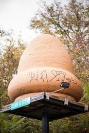 This is a Styrofoam replica of the "supposed" metallic acorn-shaped object with hieroglyphics written around the bottom. The replica is located outside the local volunteer fire department in Kecksburg. 