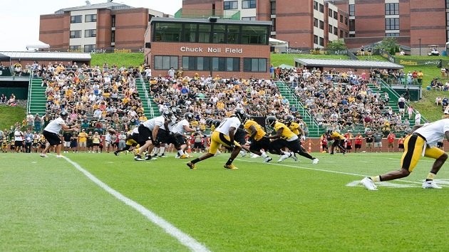 As the quarterback calls the snap cadence, ( Down, Set, Hut) the photographer gets a photo during the Pittsburgh Steelers training camp. 