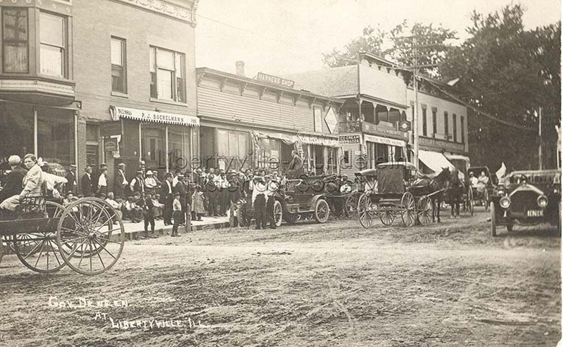 West side of Milwaukee looking north from Cook Avenue, about 1908. The bank building replaced the one-story building marked harness shop.