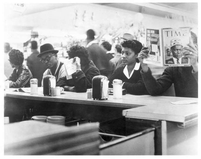 Students sitting at the counter during the protest