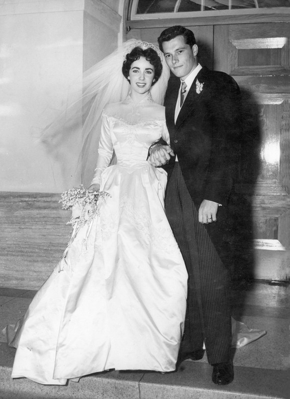 Elizabeth Taylor and Conrad Hilton, Jr. after their wedding at Church of The Good Shepherd on May 6, 1950