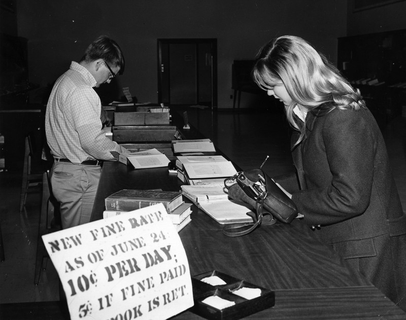 Woman paying a parking ticket, 1969.  EKU Photograph Collection.