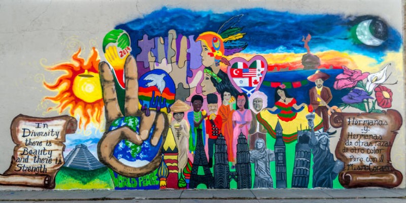“In Diversity there is Beauty and there is Strength/Hermanos y hermanas de otras razas de color pero con el mismo corazón” Immigration is Beautiful Mural