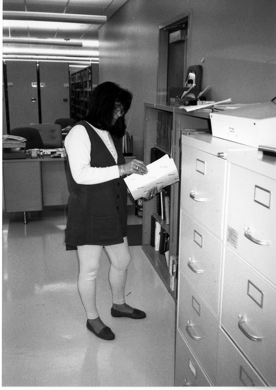 Archives assistant Trisha Henson looking through a file, 1996.  EKU Photo Collection.