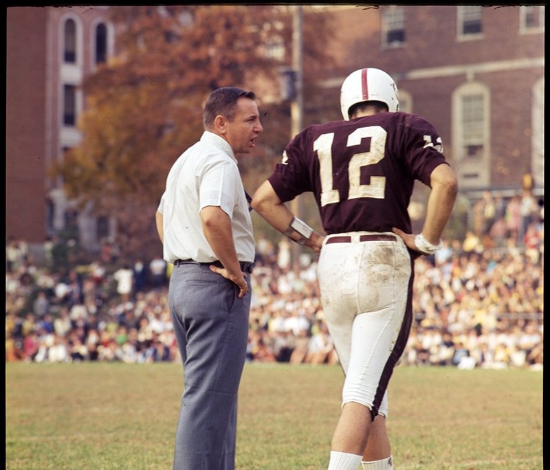 EKU coach Roy Kidd talking to quarterback, Jim Guice, during the Morehead game, 1968. EKU Color Transparencies