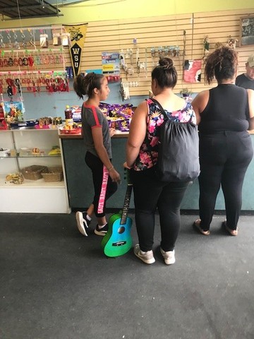 People buying products at La Laguna Market 