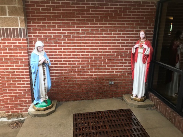 Jesus Christ and Virgin Mary located near The entrance 