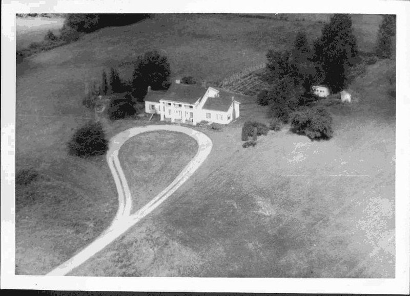 This is an aerial view of the house built by Frederick Hewitt who bought the tavern property in 1922. The house now serves as the visitor center for the historic site. Credit: Michigan Historical Center