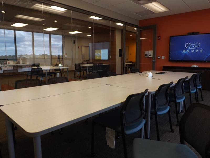 The Seminar Room seats twelve and includes a monitor, whiteboard, and motorized camera for video calls. 