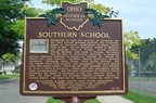 A marker in the Southern Playground detailing the history of the school.