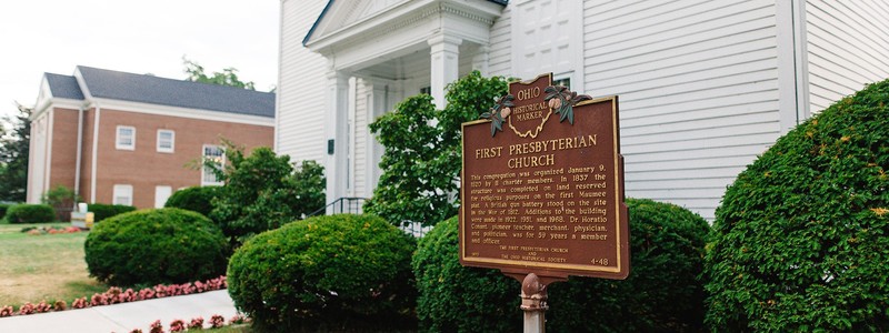 A historical marker in front of the church.