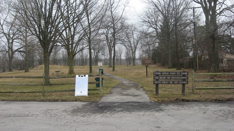 A wide shot of the marker in the park.