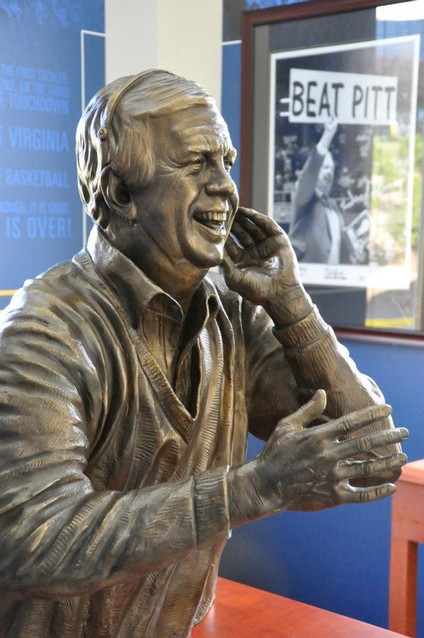 Fleming's statue is surrounded by inscriptions of his most famous quotes, and images and artifacts from his time as a broadcaster.