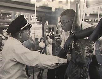 Security guard Frank Collins confronts NAG protester Marvis Saunders, National Park Service Glen Echo Park Photo Archives (reproduced under Fair Use)