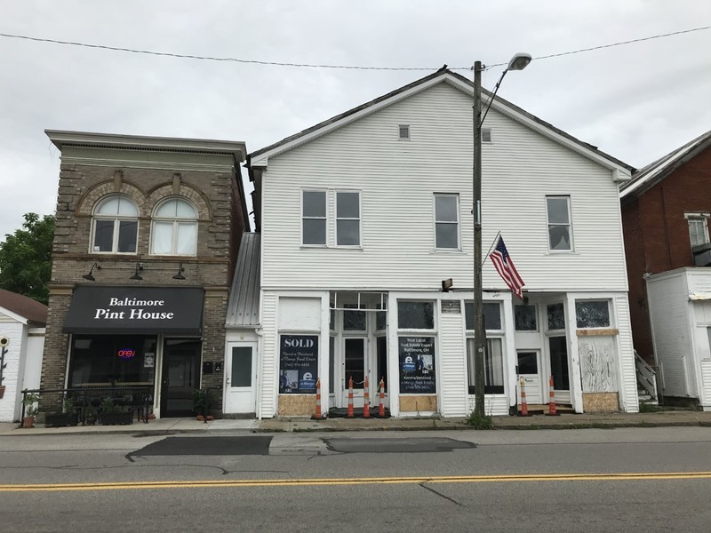 The Twin City Bakery and Lunch Room as it stands today, it is the white building to the right of the photo. The building was recently sold by The Hometown Team, e-Merge Real Estate. 