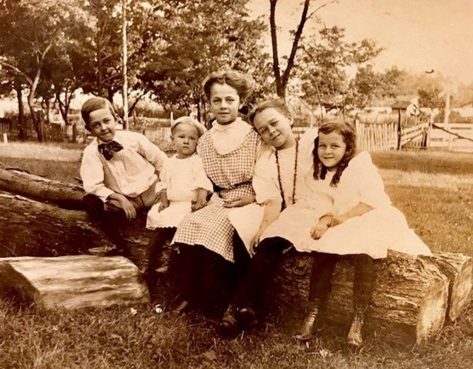 This photo of the Thomas’ five children was used on a bakery calendar circa 1905. The boy on the far left is Kirk and the girl on the far right is Aveline.