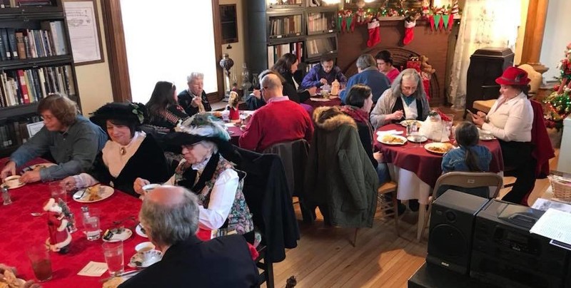 Historical society members enjoy a holiday get together in the Buck House. 